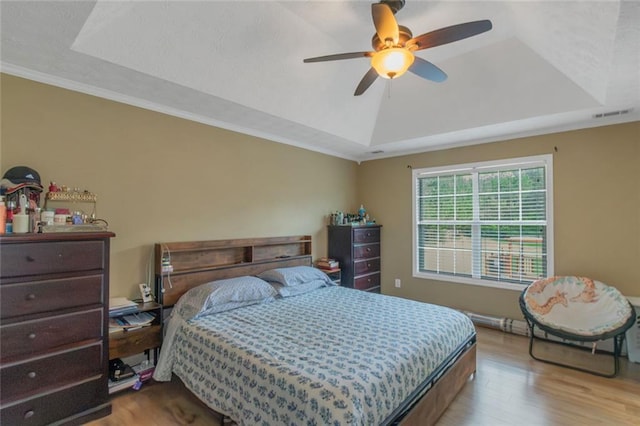 147 Midland Dr, Stockbridge, GA 30281 - bedroom featuring a raised ceiling, wood finished floors, ceiling fan, and ornamental molding