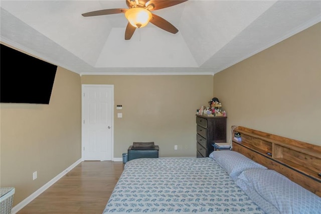 147 Midland Dr, Stockbridge, GA 30281 - bedroom with a tray ceiling, wood finished floors, baseboards, a ceiling fan, and crown molding