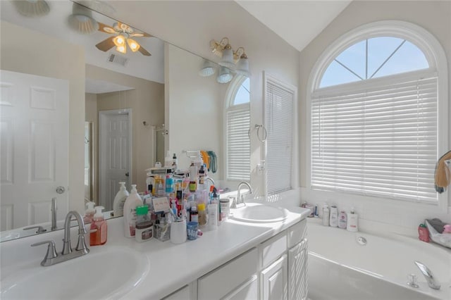 147 Midland Dr, Stockbridge, GA 30281 - full bathroom featuring double vanity, a garden tub, ceiling fan, vaulted ceiling, and a shower