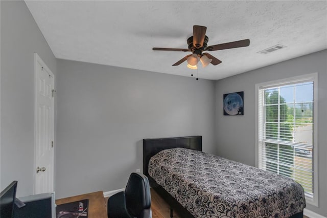 147 Midland Dr, Stockbridge, GA 30281 - bedroom featuring baseboards, ceiling fan, and wood finished floors