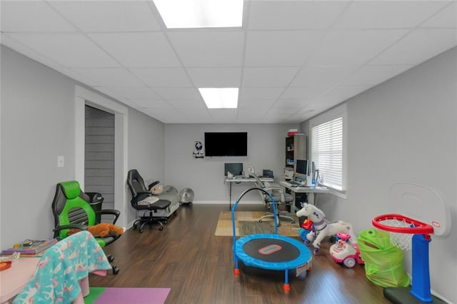 147 Midland Dr, Stockbridge, GA 30281 - recreation room featuring wood finished floors, a paneled ceiling, baseboards, and a desk