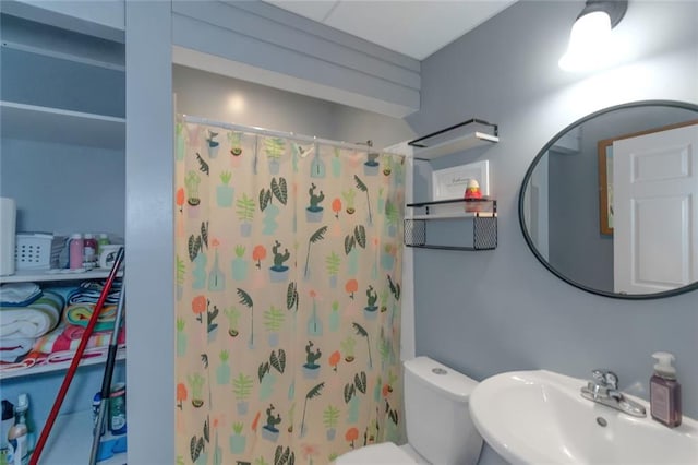 147 Midland Dr, Stockbridge, GA 30281 - bathroom featuring a sink, toilet, and a shower with shower curtain