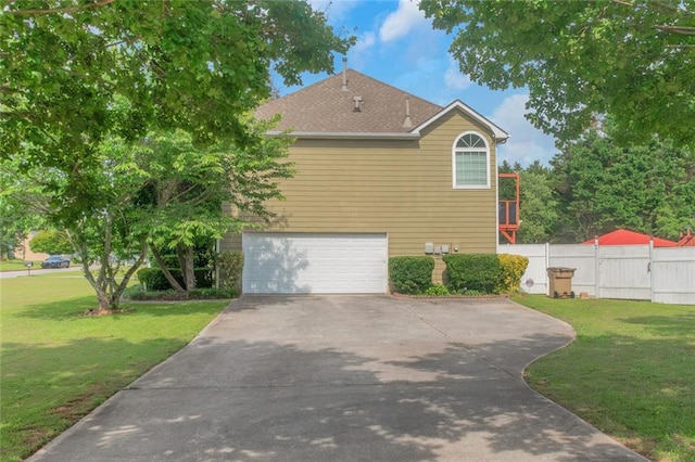 147 Midland Dr, Stockbridge, GA 30281 - view of home's exterior featuring concrete driveway, a garage, and roof with shingles