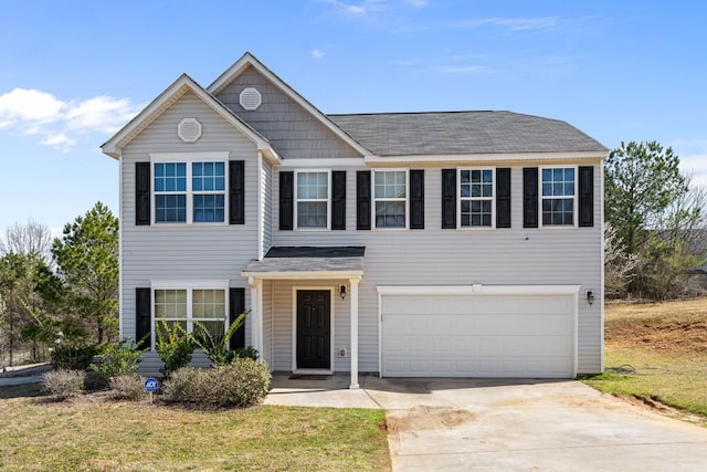 view of front of house with a garage and driveway