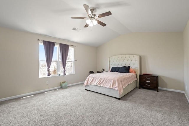 bedroom with a ceiling fan, baseboards, visible vents, vaulted ceiling, and carpet flooring