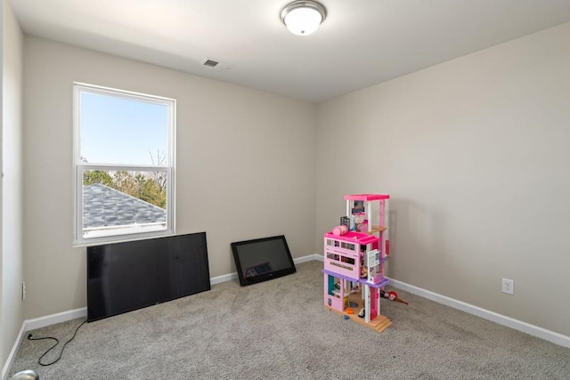 playroom with carpet flooring, baseboards, and visible vents