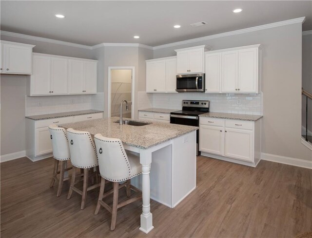 kitchen with white cabinets and stainless steel appliances