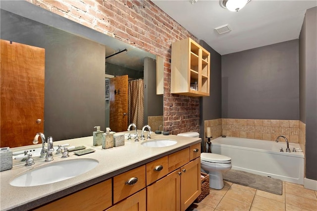 bathroom featuring toilet, tile patterned flooring, a sink, and visible vents