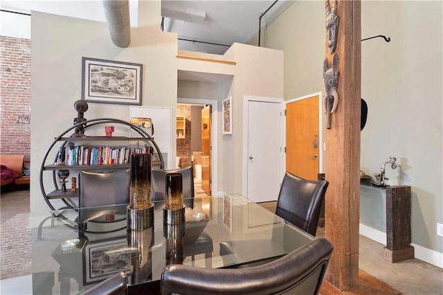 dining area with brick wall