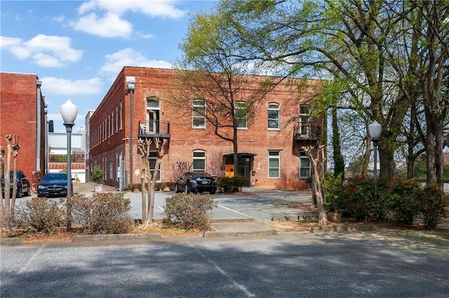 view of property with uncovered parking