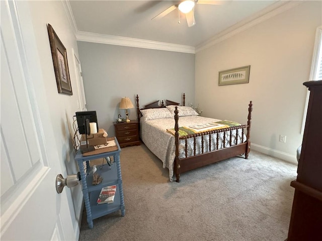 carpeted bedroom with ceiling fan and ornamental molding