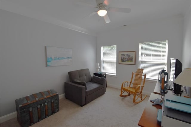 living area with ceiling fan and light colored carpet