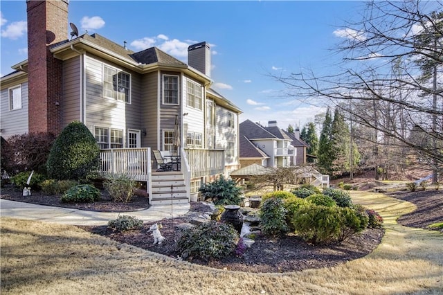 view of home's exterior with a wooden deck