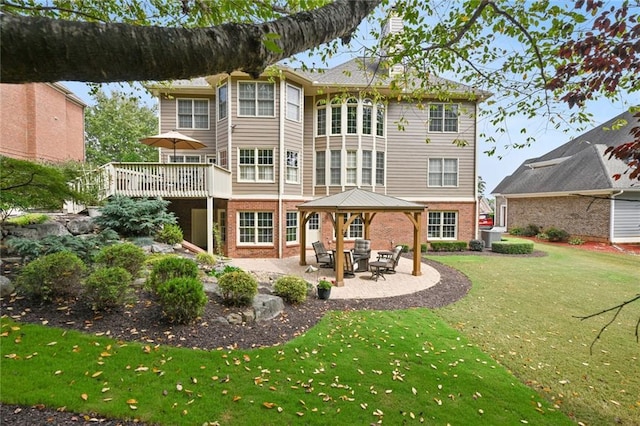 back of house with a lawn, a gazebo, a wooden deck, central AC, and a patio