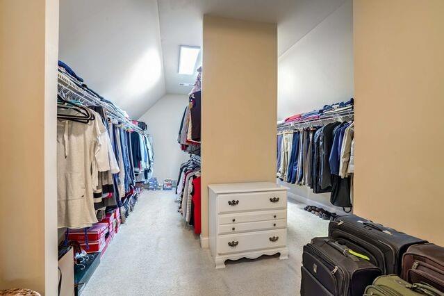 spacious closet with vaulted ceiling