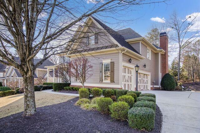 view of property exterior featuring a garage