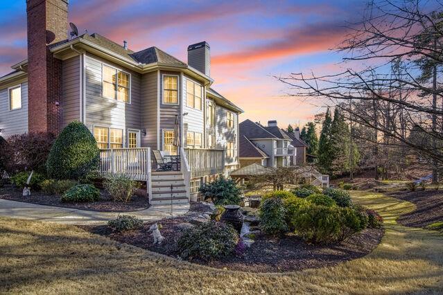 property exterior at dusk with a deck