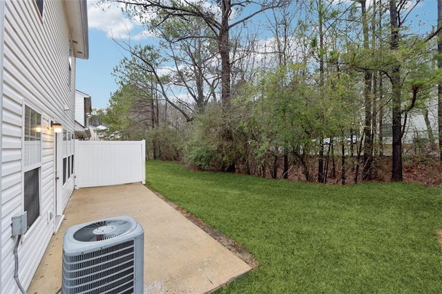 view of yard featuring a patio and central AC