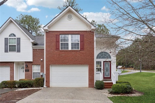 view of front of home featuring a garage and a front lawn