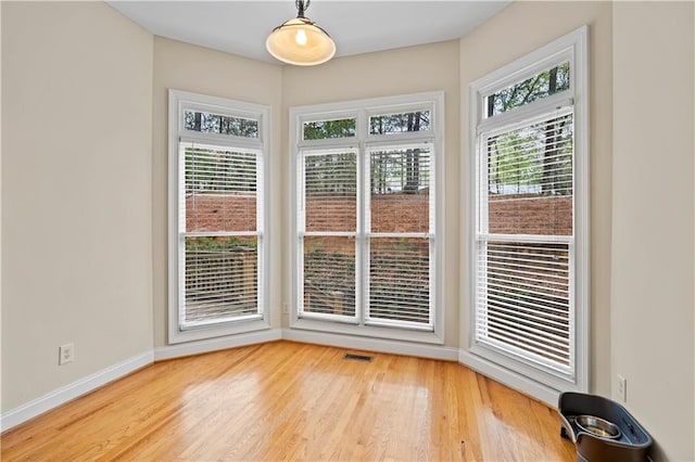 5955 Manchester Ln, Gainesville, GA 30506 - unfurnished dining area featuring light wood-type flooring and baseboards