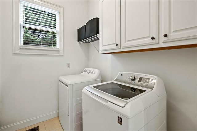 5955 Manchester Ln, Gainesville, GA 30506 - washroom with washer and dryer, cabinet space, baseboards, and light tile patterned floors