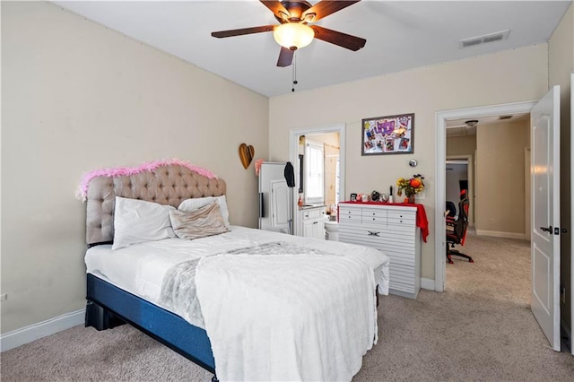 5955 Manchester Ln, Gainesville, GA 30506 - bedroom featuring light colored carpet, baseboards, ceiling fan, and connected bathroom
