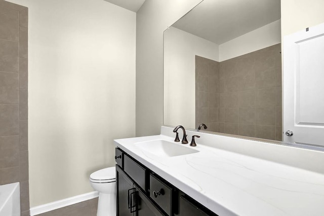 full bathroom featuring vanity, toilet, a bath, and baseboards