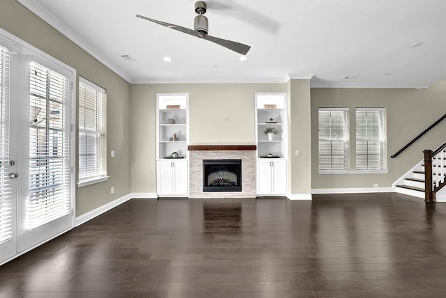 unfurnished living room with a healthy amount of sunlight, ceiling fan, and dark wood-style flooring