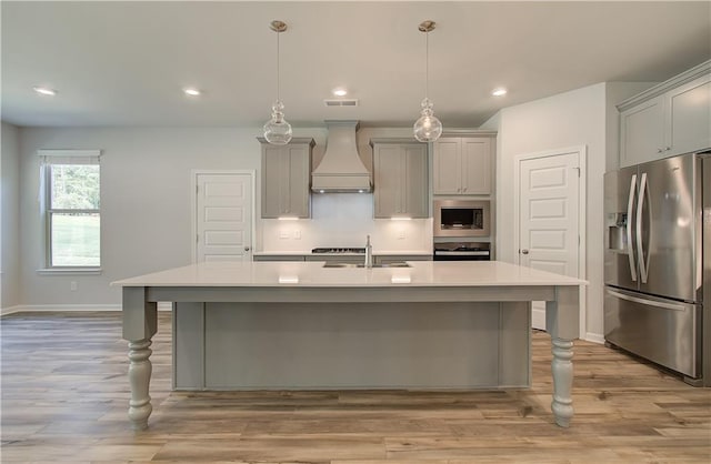 2516 Cadenza Cir, Dacula, GA 30019 - kitchen with appliances with stainless steel finishes, custom exhaust hood, gray cabinetry, light countertops, and recessed lighting