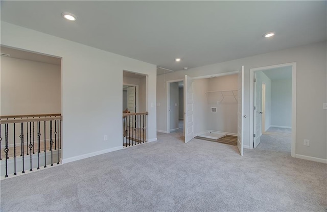 2516 Cadenza Cir, Dacula, GA 30019 - unfurnished bedroom with attic access, carpet flooring, recessed lighting, and a walk in closet