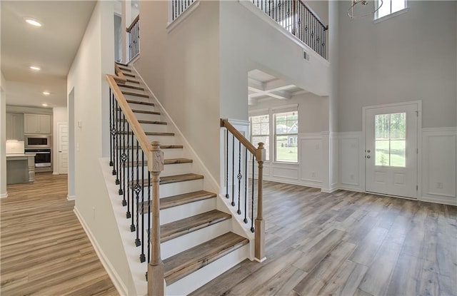 2516 Cadenza Cir, Dacula, GA 30019 - foyer with a towering ceiling, light wood-style floors, stairway, recessed lighting, and a decorative wall