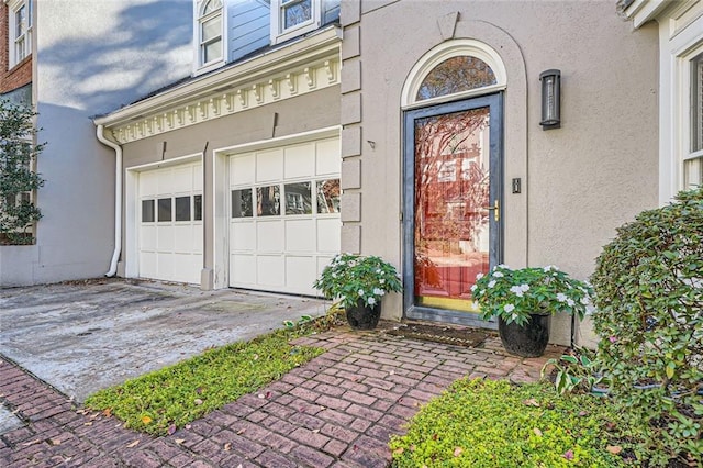 property entrance with a garage