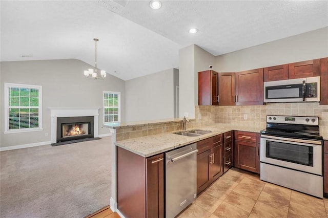 5600 Walnut Creek Ct NW, Lilburn, GA 30047 - kitchen with stainless steel appliances, backsplash, a sink, lofted ceiling, and light stone counters