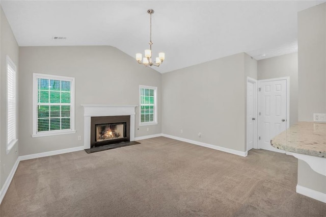 5600 Walnut Creek Ct NW, Lilburn, GA 30047 - unfurnished living room with a chandelier, carpet flooring, lofted ceiling, and a fireplace with flush hearth