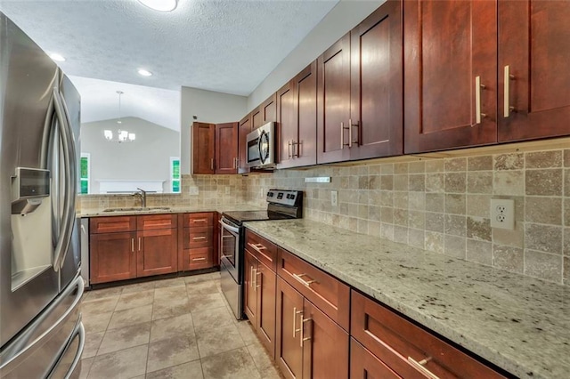 5600 Walnut Creek Ct NW, Lilburn, GA 30047 - kitchen with appliances with stainless steel finishes, vaulted ceiling, backsplash, a chandelier, and a textured ceiling