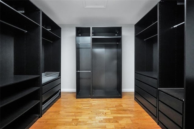 5600 Walnut Creek Ct NW, Lilburn, GA 30047 - walk in closet with light wood-style flooring