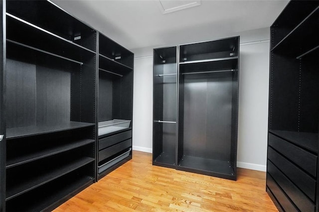5600 Walnut Creek Ct NW, Lilburn, GA 30047 - walk in closet with wood finished floors