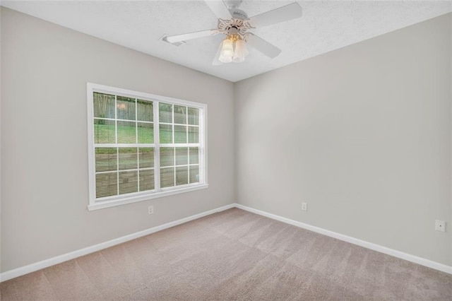 5600 Walnut Creek Ct NW, Lilburn, GA 30047 - spare room with carpet floors, baseboards, a ceiling fan, and a textured ceiling