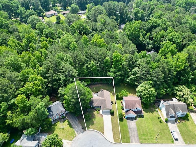 5600 Walnut Creek Ct NW, Lilburn, GA 30047 - aerial perspective of suburban area featuring property parcel outlined and a forest