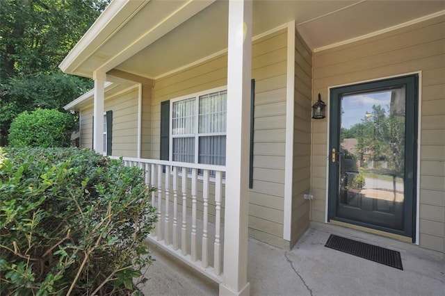 5600 Walnut Creek Ct NW, Lilburn, GA 30047 - view of exterior entry featuring covered porch