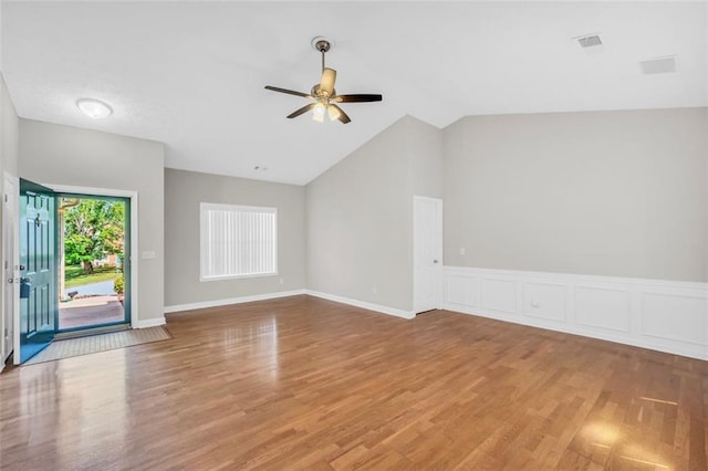 5600 Walnut Creek Ct NW, Lilburn, GA 30047 - empty room with ceiling fan, vaulted ceiling, and wood finished floors
