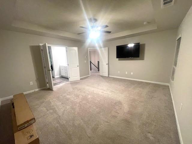 interior space featuring carpet floors and ceiling fan