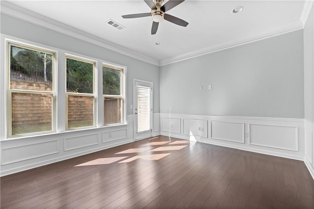 unfurnished room featuring ceiling fan, dark hardwood / wood-style flooring, and ornamental molding