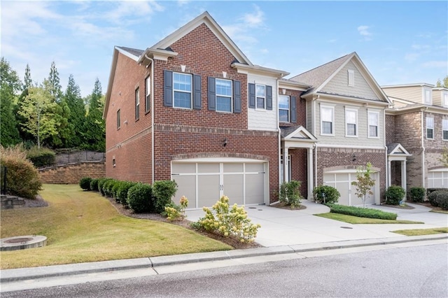 view of front of property with a front yard and a garage