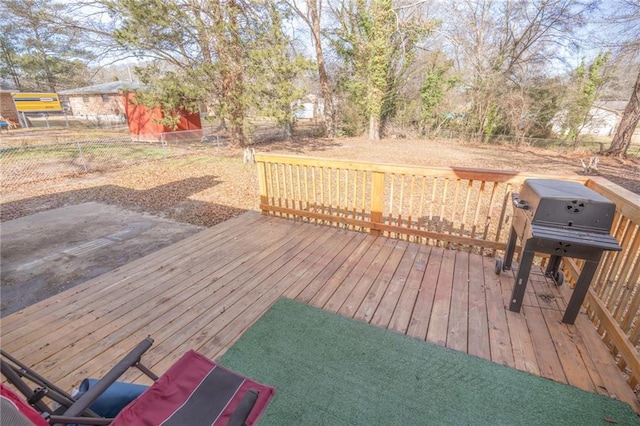 wooden terrace featuring grilling area