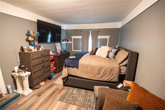 bedroom with light hardwood / wood-style flooring