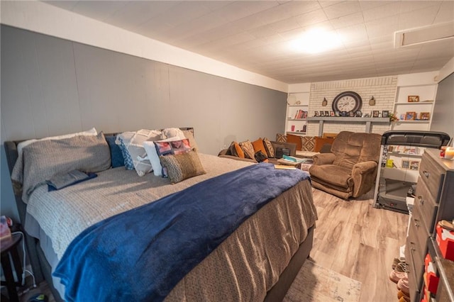 bedroom with light wood-type flooring