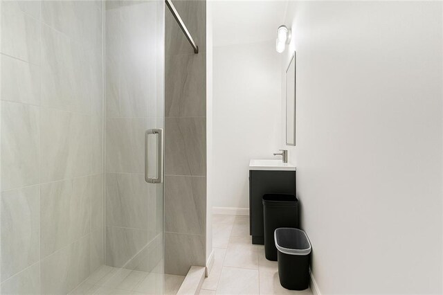 5150 Wheat St NE, Covington, GA 30014 - bathroom with a shower stall, vanity, tile patterned floors, and baseboards