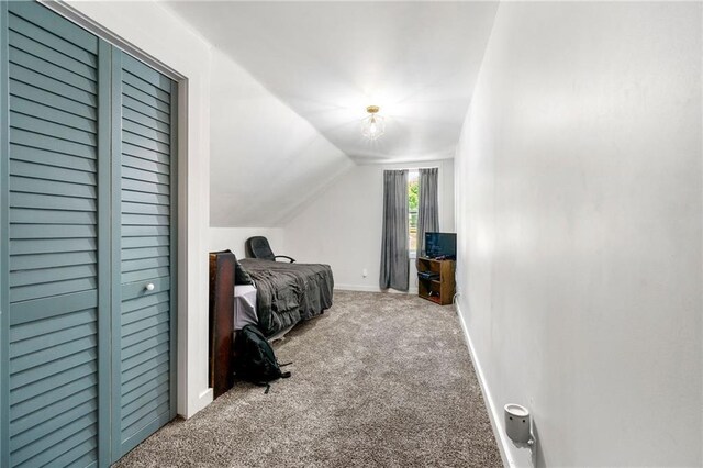 5150 Wheat St NE, Covington, GA 30014 - bedroom featuring carpet floors, lofted ceiling, and baseboards