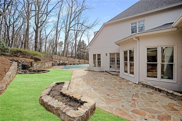 view of yard with a patio, fence, and a fenced in pool